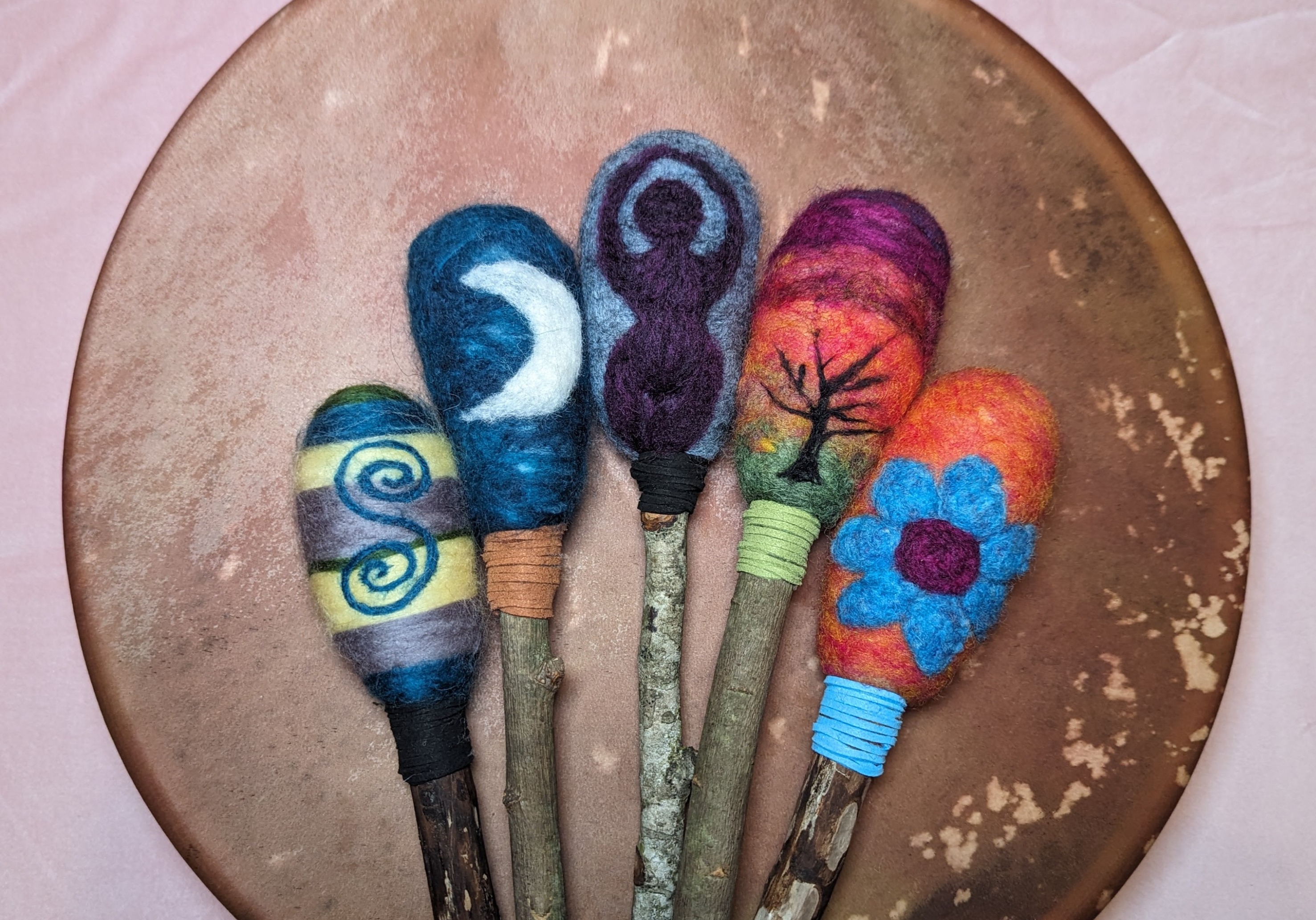 Emma's handcrafted rattle necklaces and beaters